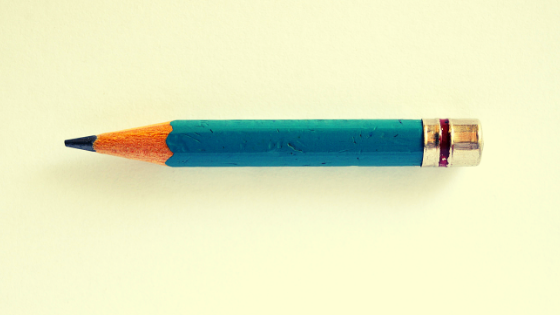 Short blue pencil on yellow background